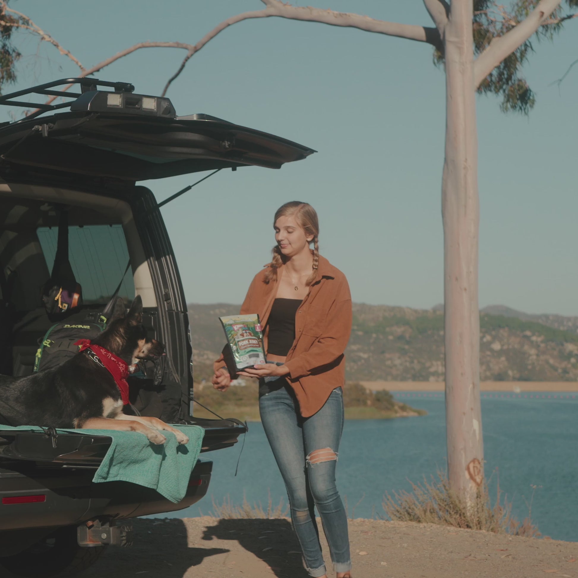 Video of a woman giving her dog the pork jerky treat