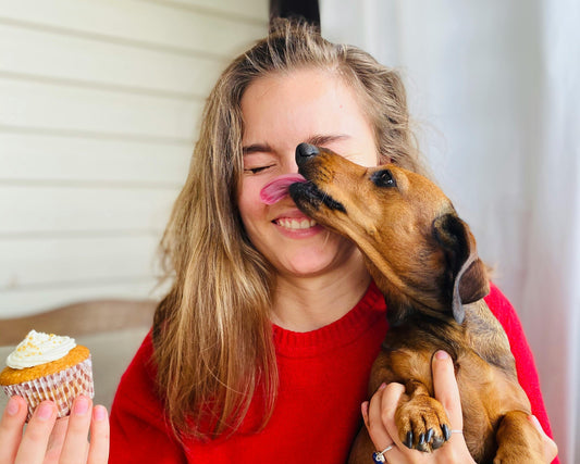 Dog licking girl