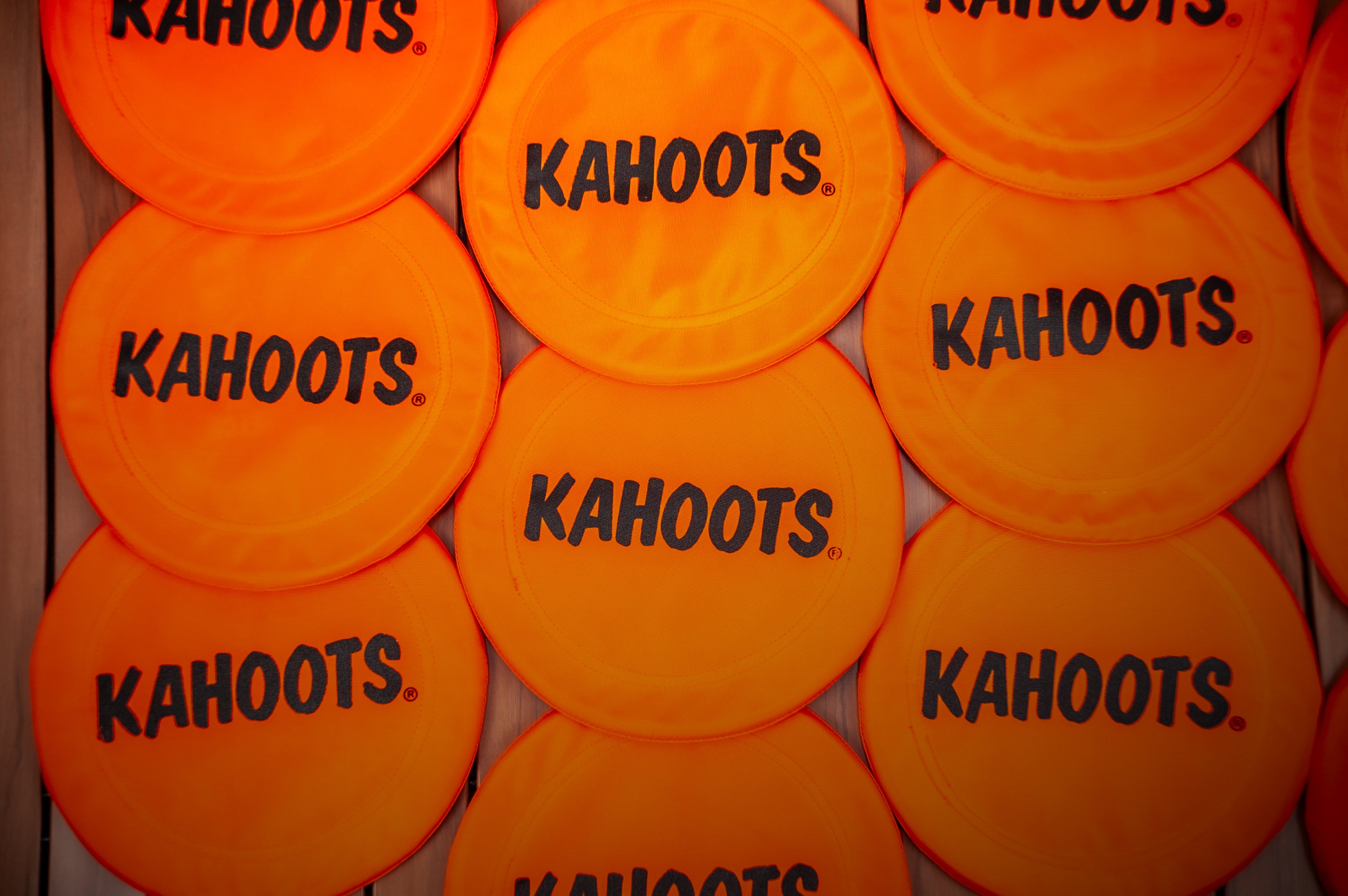 orange frisbees against a wood background