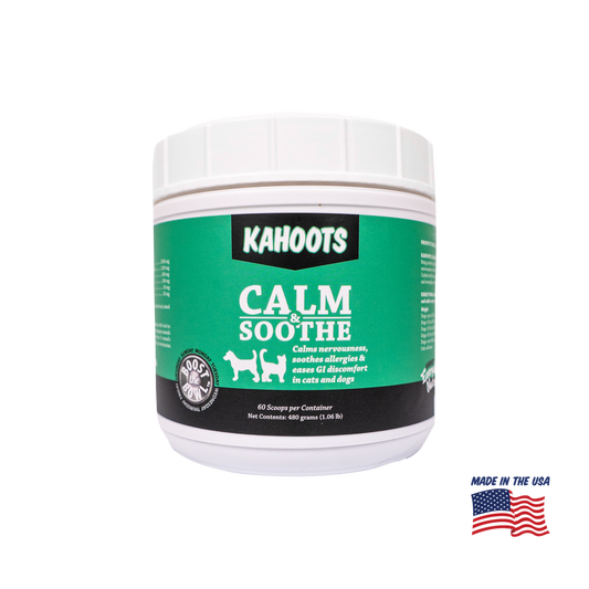 A white plastic tub of Kahoots Calm Soothe pet supplement with a green and black label, shown on a white background with a 'Made in the USA' flag graphic in the bottom right corner.