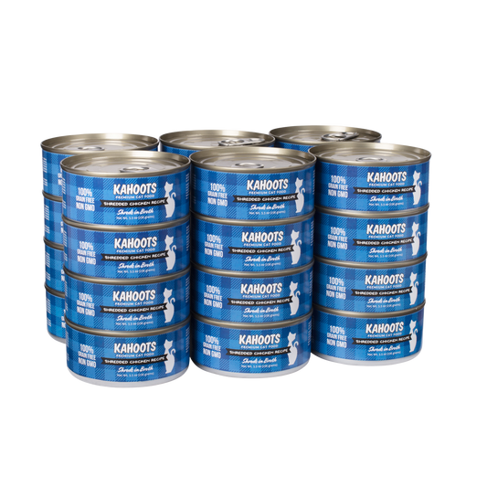 Case quantity of chicken shreds in broth wet cat food can. White cat over a blue checkered background