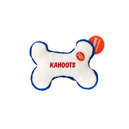 White, fuzzy, plush bone with "Kahoots" embroidered in the middle