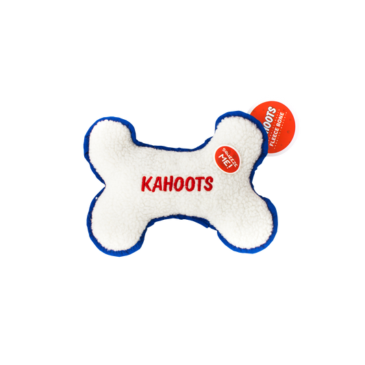 White, fuzzy, plush bone with "Kahoots" embroidered in the middle