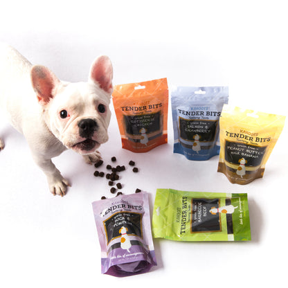 French bulldog standing in front of a variety of tender bits dog training treats