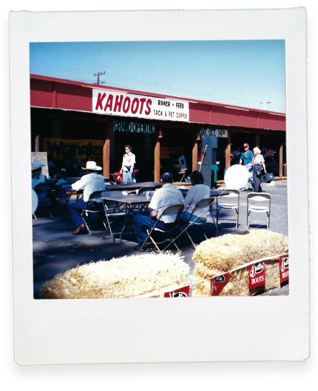 Kahoots ramona opening. People sitting in front of store in folding chairs