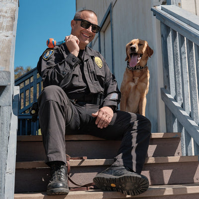 Police officer from the San Diego Police Department and his canine waiting for a ball to be thrown
