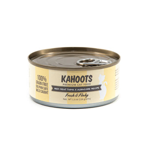 Red meat tuna and albacore wet cat food can. White cat over a yellow stripe background