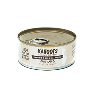 Sardine and Chicken wet cat food. White cat over cream colored striped background on the label