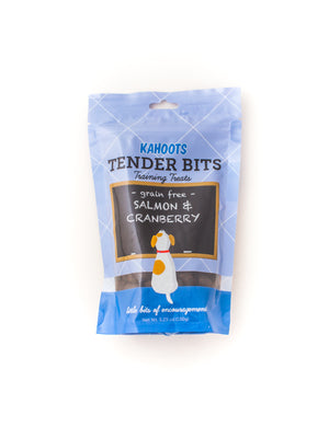 Salmon and cranberry dog treats in a bag. Picture of a cartoon dog sitting in front of a chalk board over a blue background