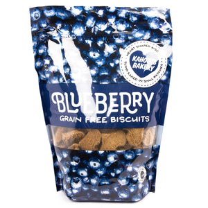 Blueberry dog biscuits in a bag. The bag is covered in pictures of blueberries 