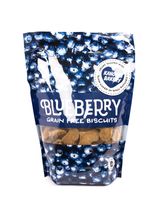 Blueberry dog biscuits in a bag. The bag is covered in pictures of blueberries 